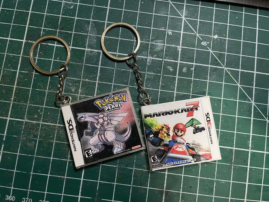 Брелок у вигляді коробки з іграми для xbox, nintendo, playstation 1-5.