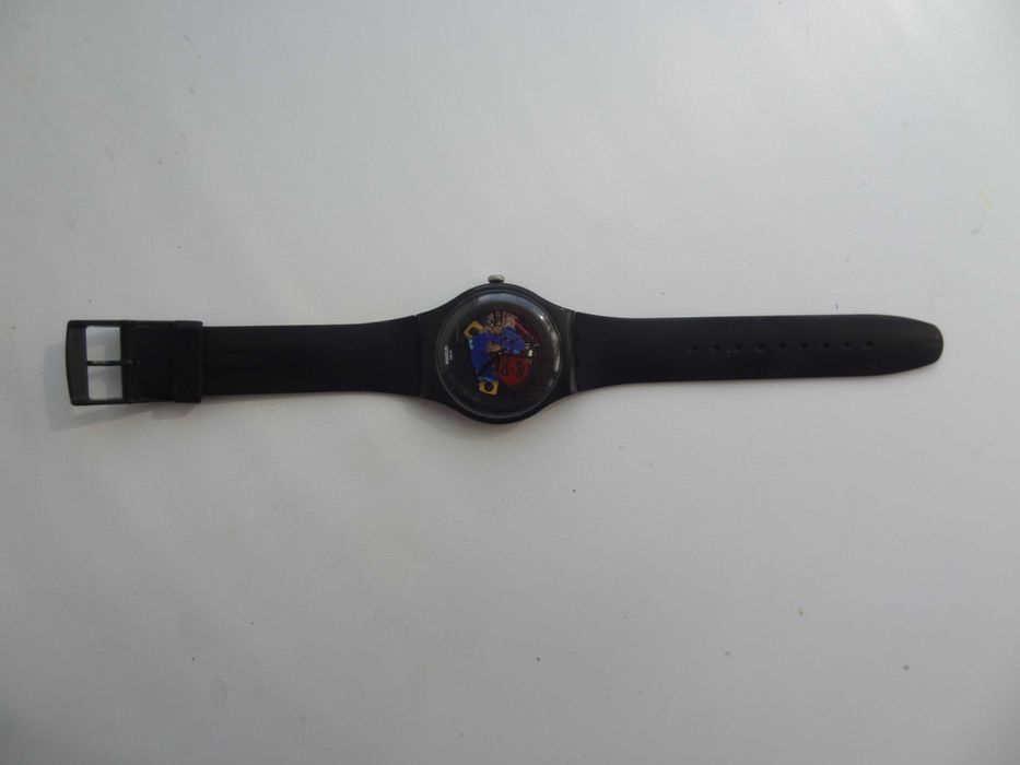 Часы Swatch черные лакированные SUOB101 с открытым механизмом скелетон
