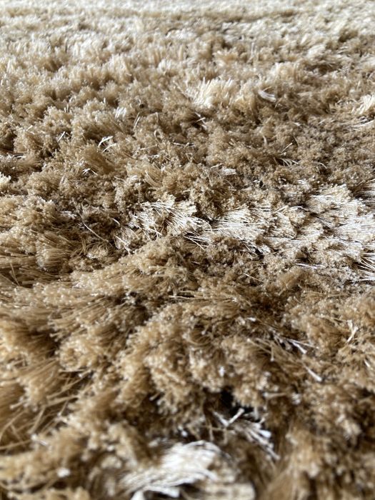 Tapete bege de pelos