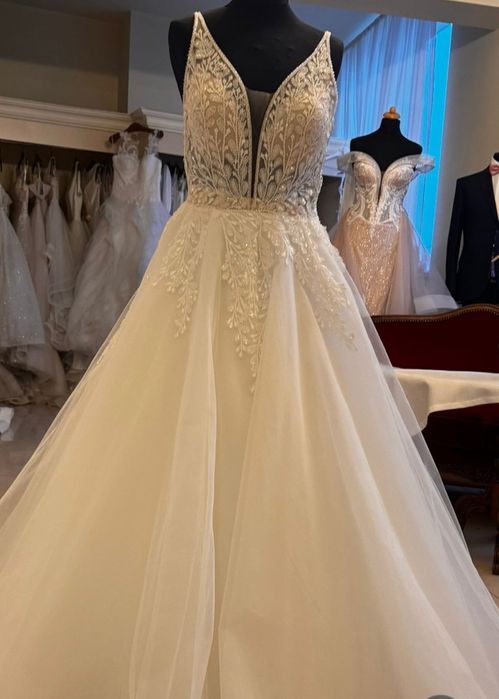 Suknia ślubna , biała z beżem cała góra z ozdobnymi koralikami