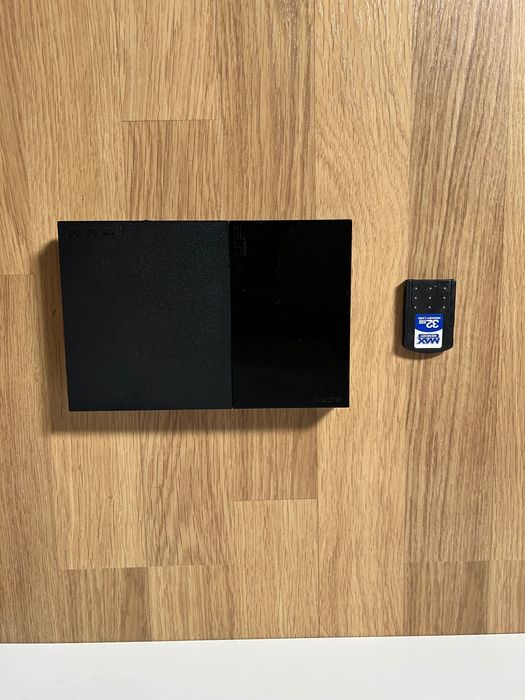 Mega Pack PS2 (Consola+ 3 Comandos+ 15 Jogos+ 2 Microfones+ 32MB Card)