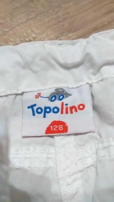Spodnie dziewczęce białe Topolino rozmiar 128