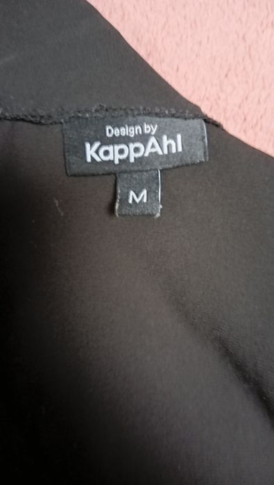 Czarny kombinezon KappAhl