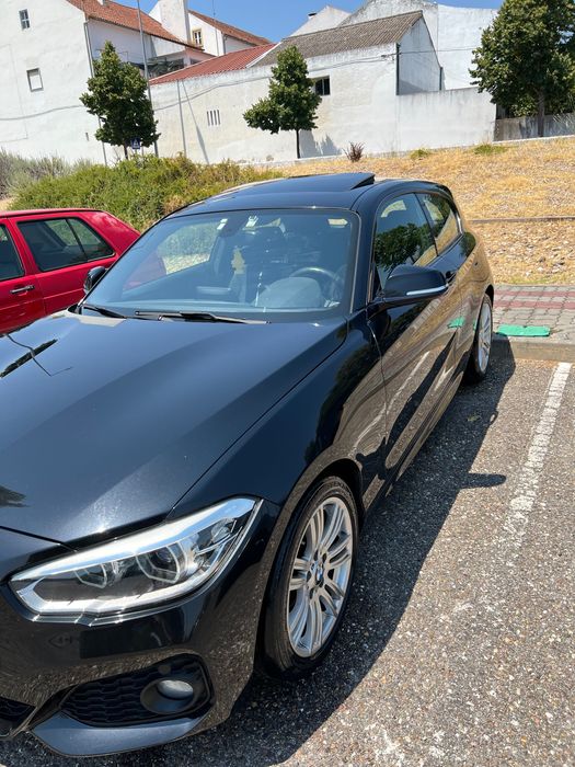 BMW 116 coupé com teto de abrir.