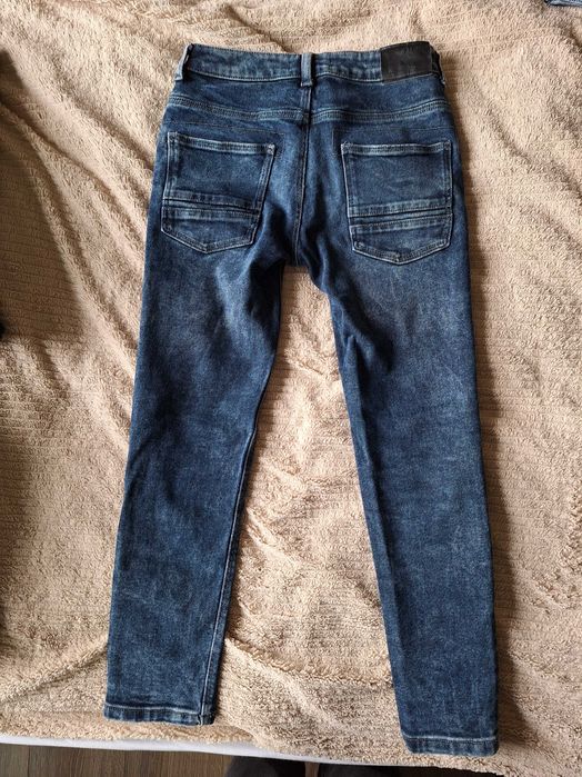 Spodnie jeansowe Reserved rozm. 140