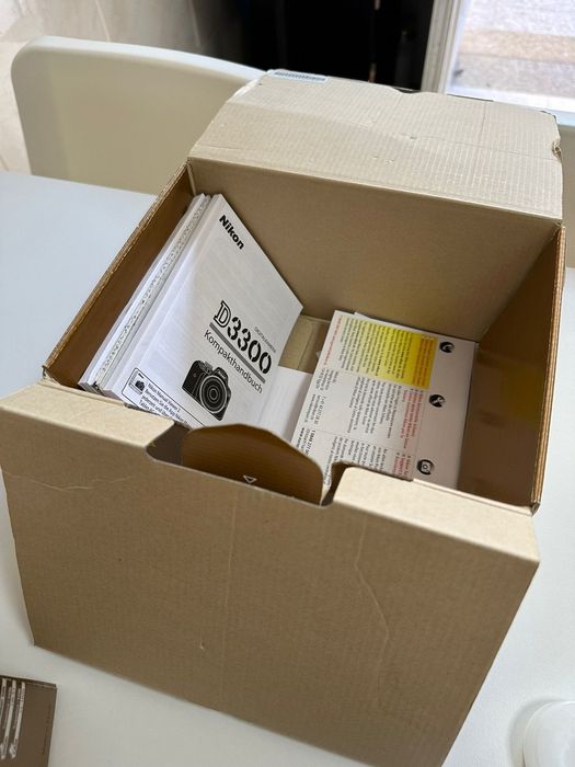 Máquina fotográfica nikon mais objetiva