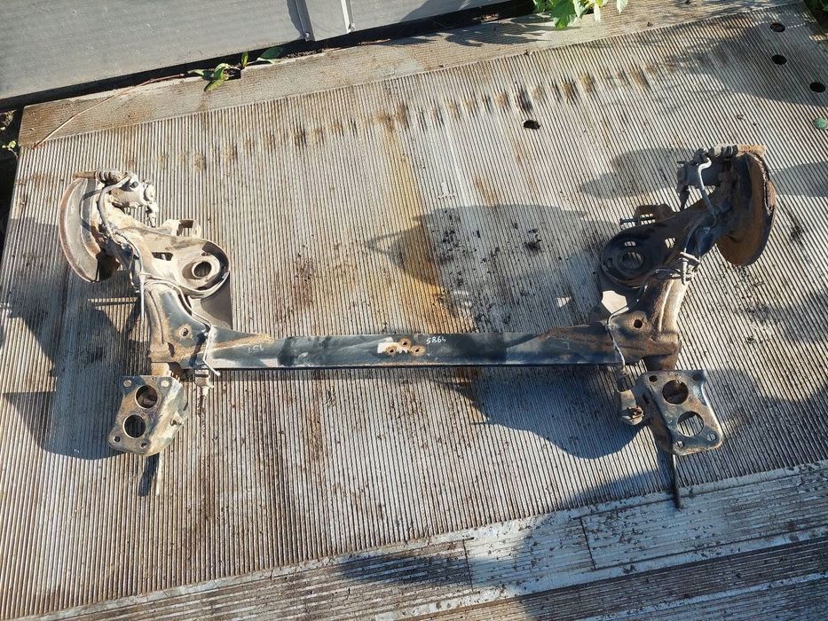 BELKA OŚ ZAWIESZENIA TYŁ TARCZE  VW GOLF IV BORA TOLEDO II LEON I