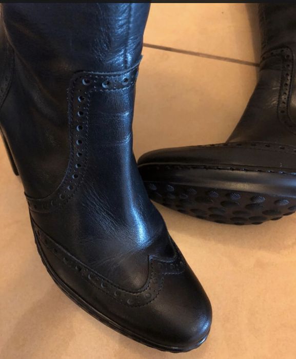 Botas em pele de camp alto da marca EXé