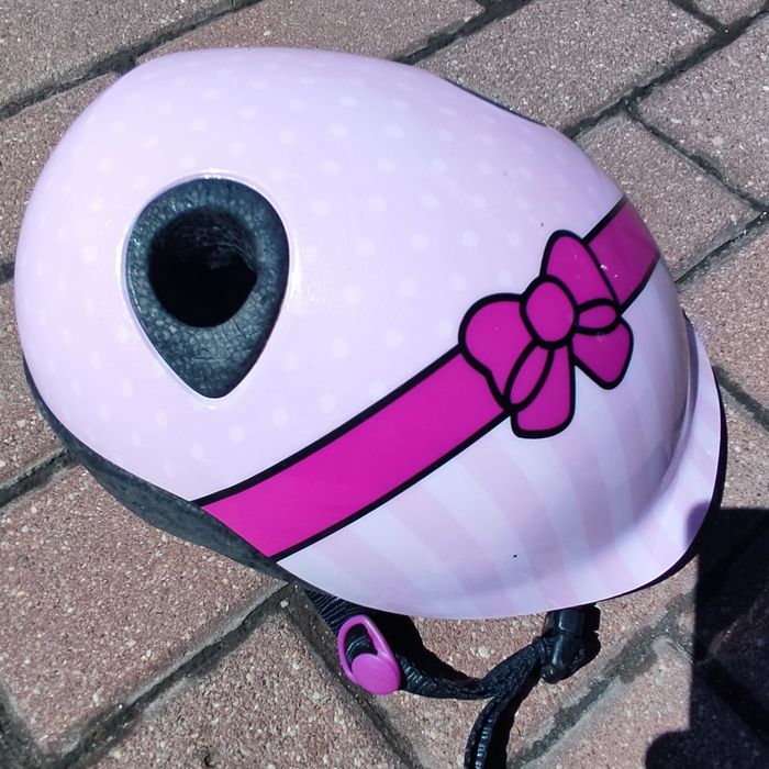 Kask rowerowy dziewczęcy B'TWIN, różowy w groszki z kokardą, 48-52 cm