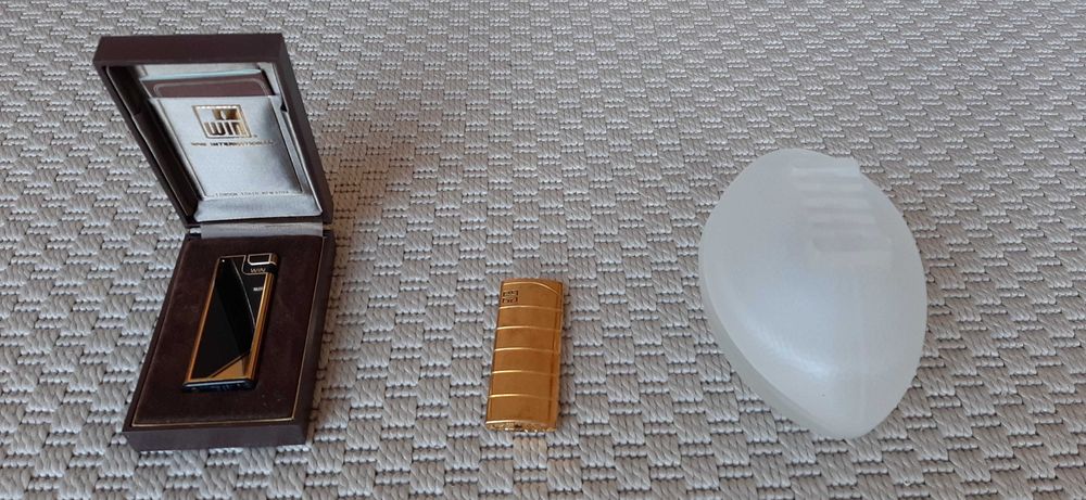 Isqueiro Win, isqueiro Givenchy e isqueiro com cinzeiro em vidro