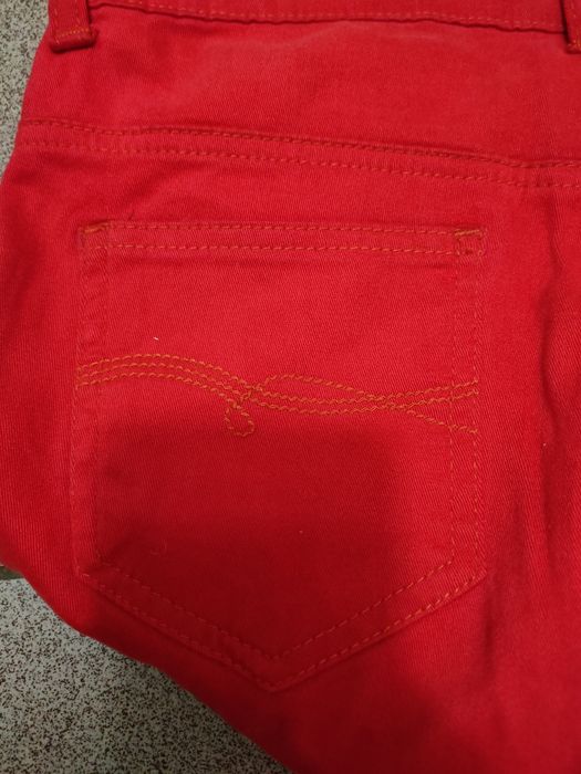 Джинсы красные женские