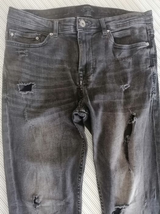 Calças de ganga "rasgadas" tam. 40
