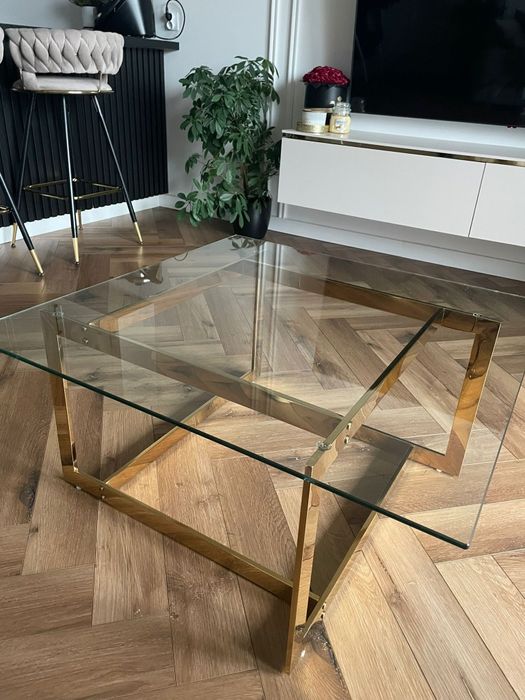 Stolik kawowy Beliani CRYSTAL - szkło hartowane, złoty stelaż-stan bdb