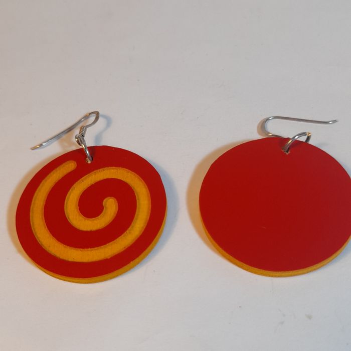 Wooden earrings in the shape of spirals.