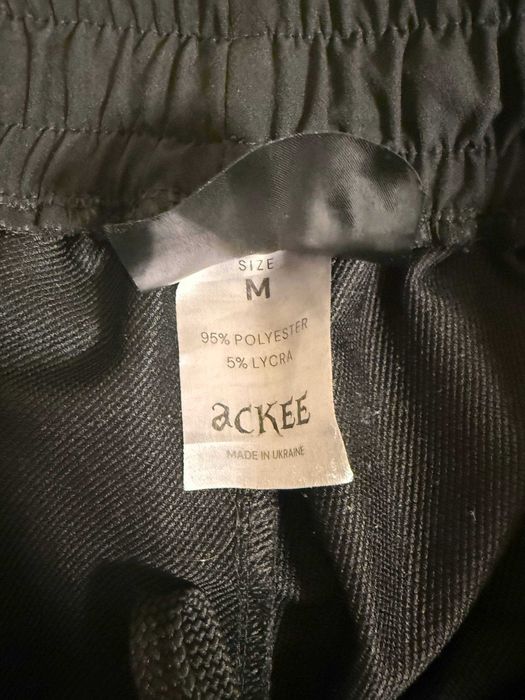 Черные штаны ackee store с белыми полосами