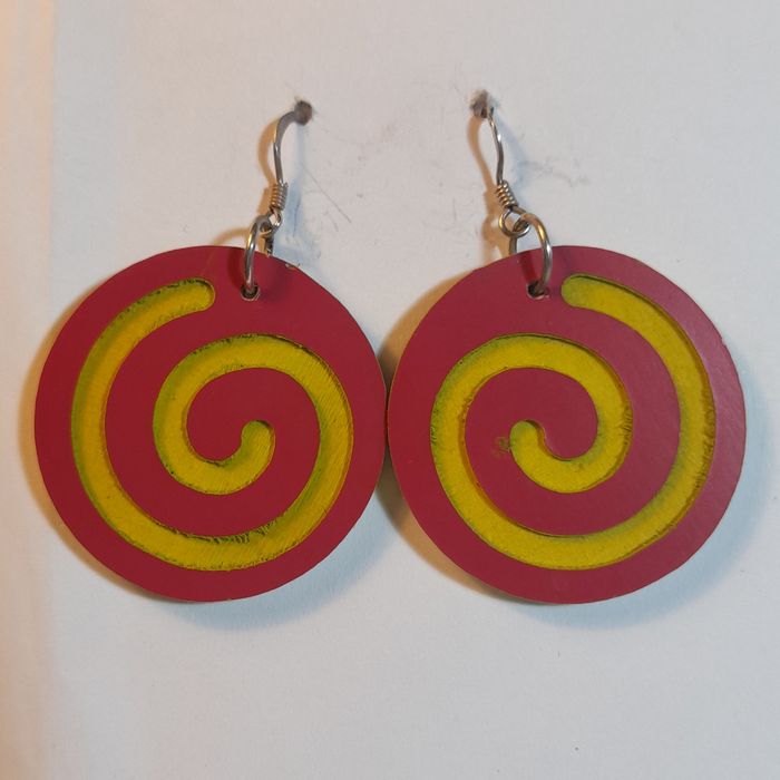 Wooden earrings in the shape of spirals.