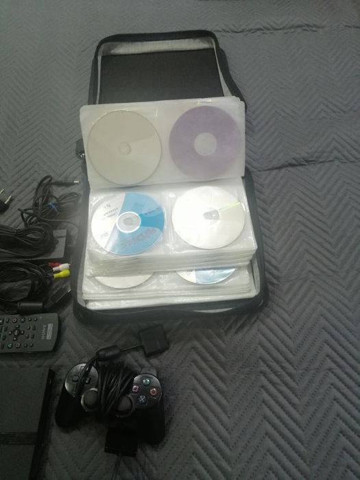Playstation 2 com jogos campainhas e extras