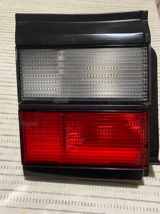 Фара VW passat ліва зад кришку багажника  HELLF нова