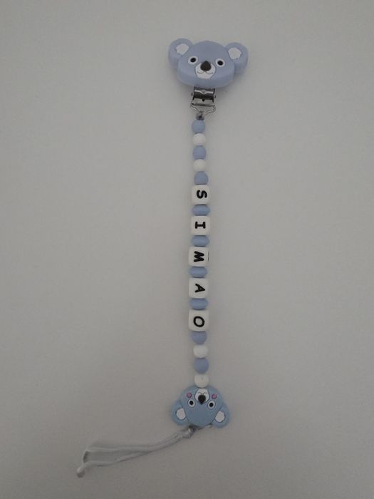 Prende chupeta azul e branco