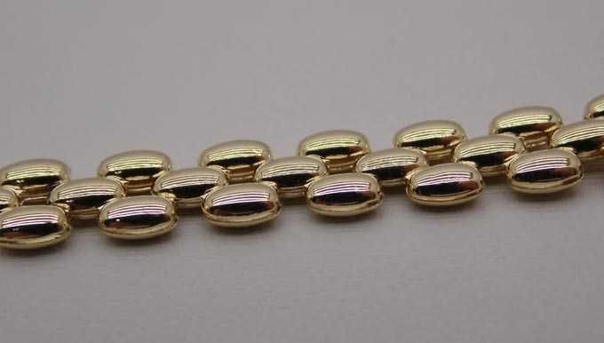 Złota bransoletka pękate ozdoby 19 cm. 6,4 mm.