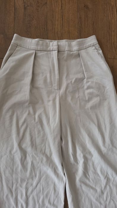 Spodnie eleganckie szeroka nogawka beżowe H&M