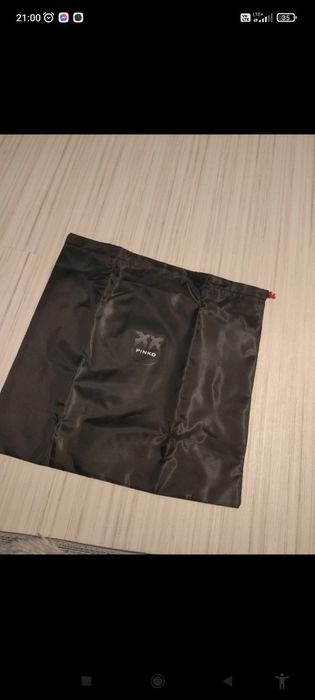 Nowy worek przeciwkurzowy marki Pinko.