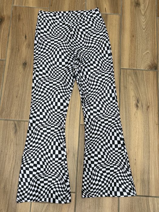 Стильні штани-кльош FB Sister в шаховий принт