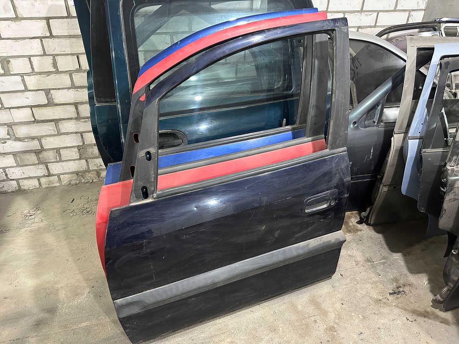 Дверь передняя левая двери Opel Zafira A