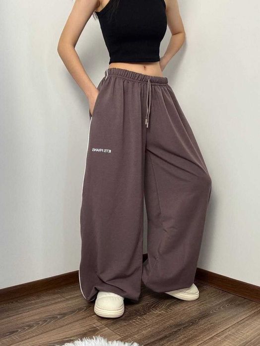 Жіночі весняні штани супер оверсайз широкі вільні с затяжками знизу