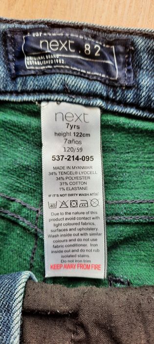 Sprzedam jeansowe spodnie z Next r.122