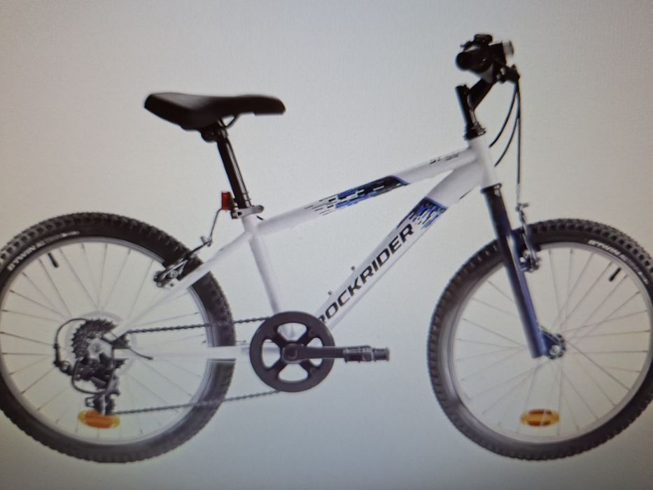 Bicicleta btt rockrider st 120 20" branco todo o terreno, com 6 velocidades e rodas/aro de 20 polegadas.