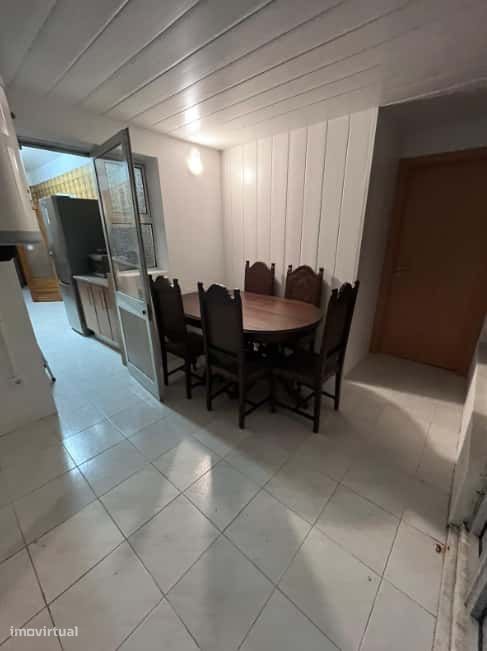 Spacious bedroom with a double bed, a desk and a couch