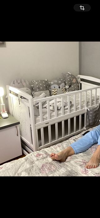 Комплект подушечок у дитяче ліжечко
