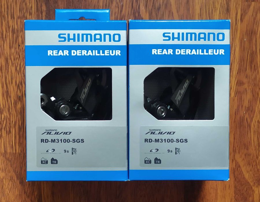 Задній перемикач Shimano Deore; SLX;(ХТ) 7--12 швидкостей