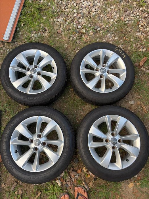 Sprzedam komplet 4 oryginalnych aluminiowych kół Opel 15" wraz z oponami zimowymi Dunlop Winter Response 2.