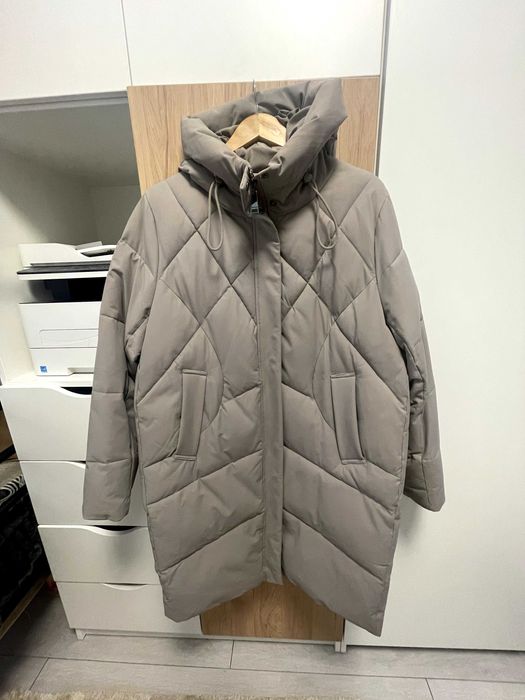 Продам теплий пухови 52 розміру