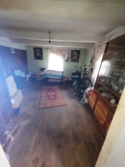 Дерев'яний будинок та земельна ділянка 14 сот. м. Кам'янка-Бузька