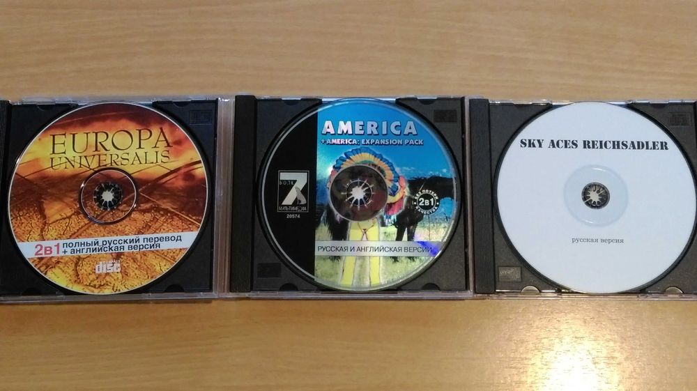 Диски с играми для ПК (цена за 7 штук).