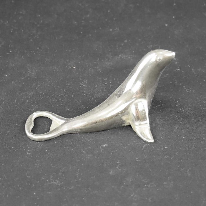 Abre cápsulas em forma de foca, metal prateado
