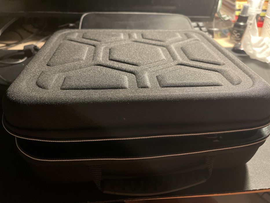 Nintendo Switch, games, charger, bag, and carrying case64284554711555121