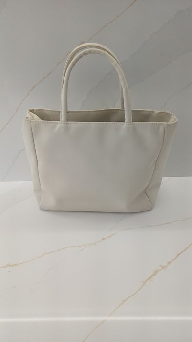 Bolsa bege em bom estado