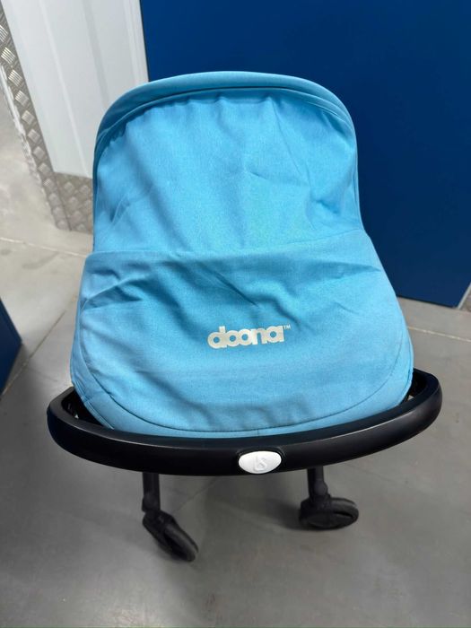 Doona+  Pack Completo: Base Isofix + Mala Oficial + Capa Chuva