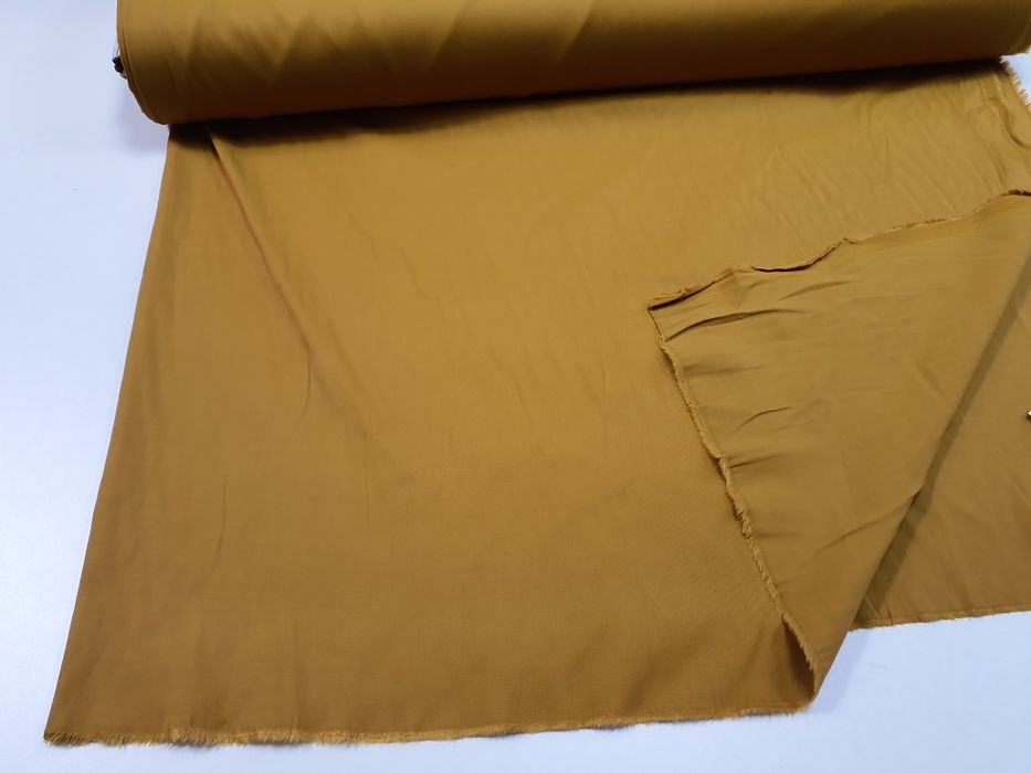 Tkanina musztardowa szer.130 cm.