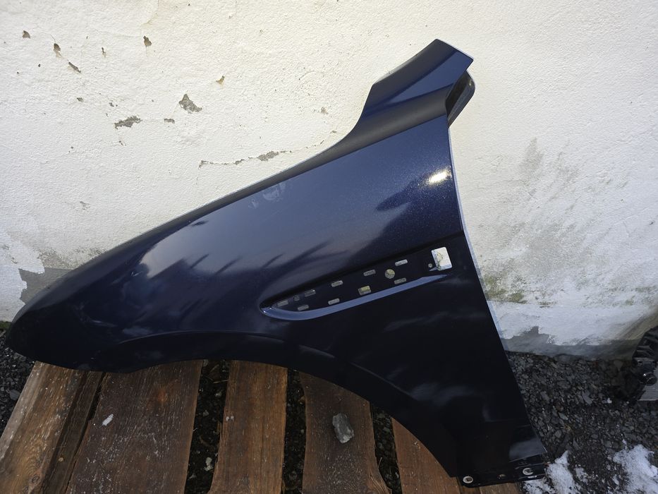 Blotnik Jaguar XF lewa strona orginalny