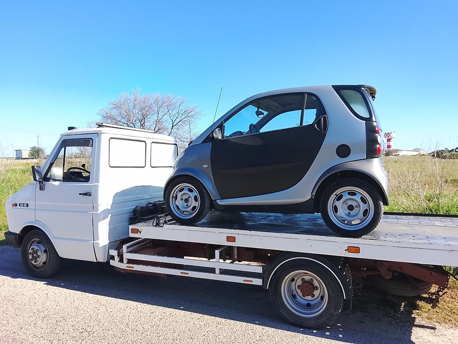 Serviços de transporte de viaturas com reboque