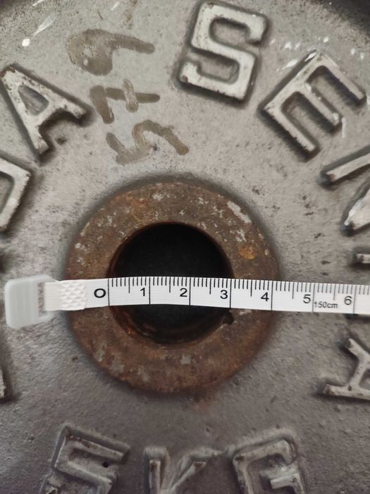 Suportes para barra e pesos de musculação