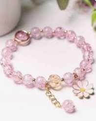 Браслет із рожевими намистинами та підвіскою-квіткою