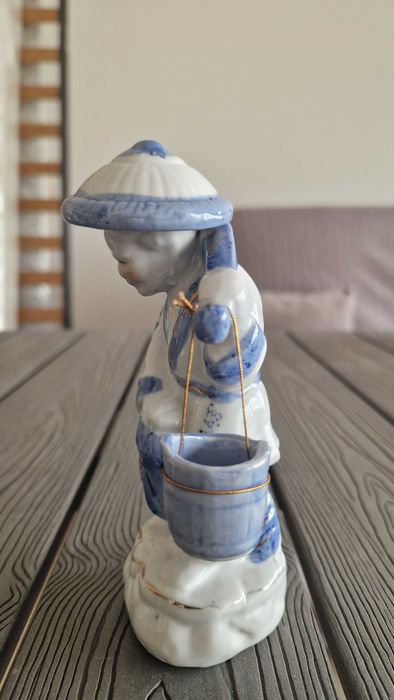 Estatueta mulher do campo asiática