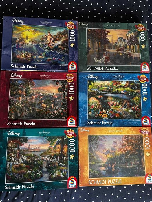 Puzzle Schmidt - Disney por Thomas Kinkade: 1000 peças; 4x 500 peças (Pequena Sereia, Aristogatos, Pocahontas, 101 Dálmatas, Rei Leão, Peter Pan)