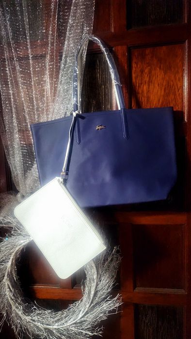 Bolsas lacoste a 60% novas com saco de embrulho